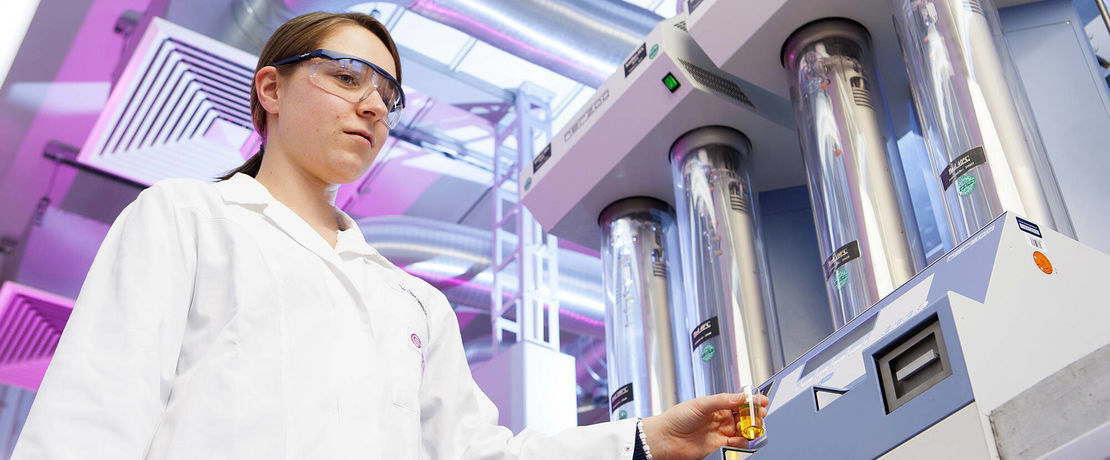 Scientist holding sample for measurement