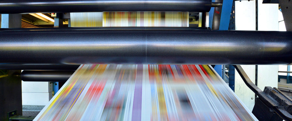 printing out pages of a magazine