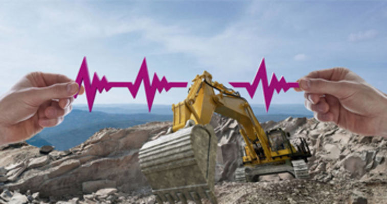 an excavator in a rock quarry